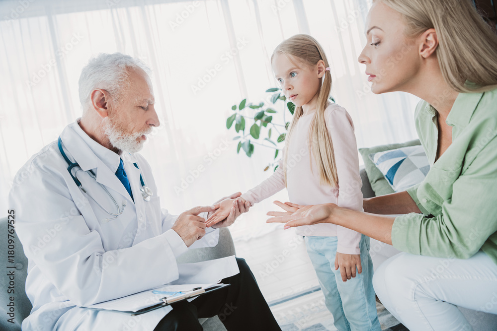 Fototapeta premium Funny caring doctor visit at home brings family together a warm check up moment