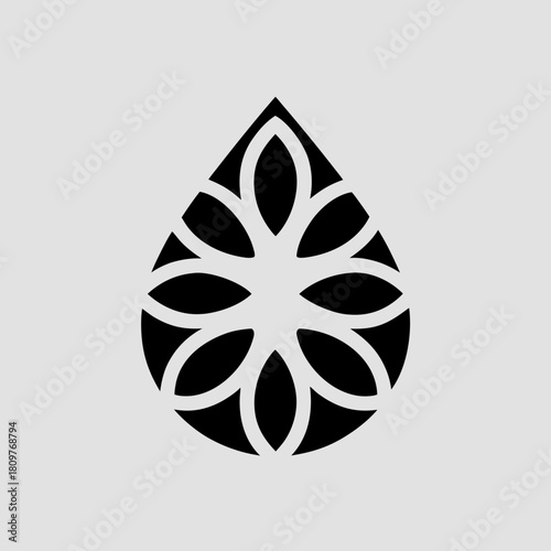 Elegant black floral design within a teardrop shape on a gray background
