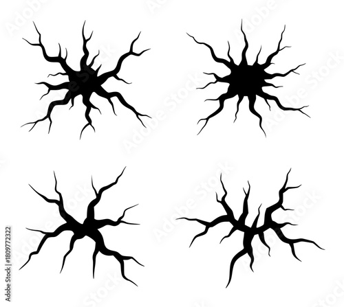 Set of Four Black Cracked Surface Silhouettes on White Background