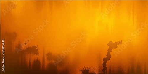 Misty morning light in the autumn forest with a tree silhouette against the sunrise sky