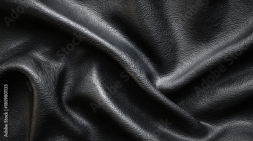Elegant black leather with a subtle texture. The material displays gentle folds and shadows, showcasing its quality and craftsmanship