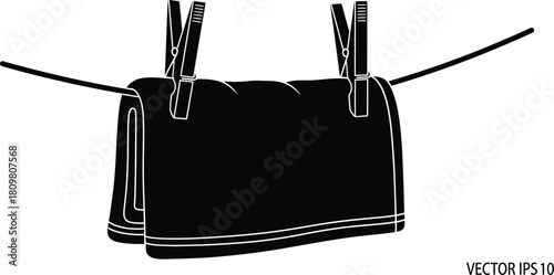 Black towel hanging with clothespins on a line, laundry and cleaning