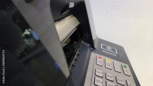 ATM dispensing cash through money slot during banking transaction. Close-up of automated teller machine releasing banknotes, concept of withdrawal, personal finance, electronic banking and modern paym
