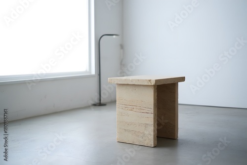 Minimalist travertine side table in bright room