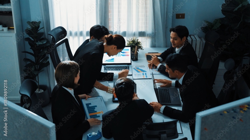 © InfiniteFlow - Top view of diverse business people brainstorm marketing idea while marketing team analyst stock market investment. Group of skilled project manager solving problems and sharing plan. Directorate.