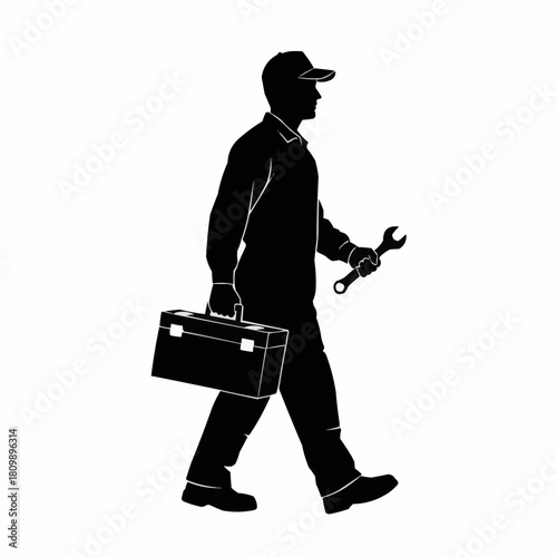 Silhouette of a Repairman Walking with Toolbox and Wrench.