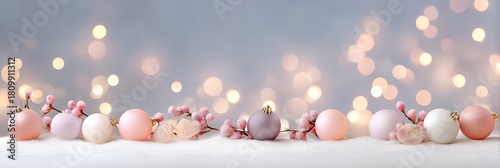 Elegant pastel christmas ornaments with pink berries and soft bokeh lights background
