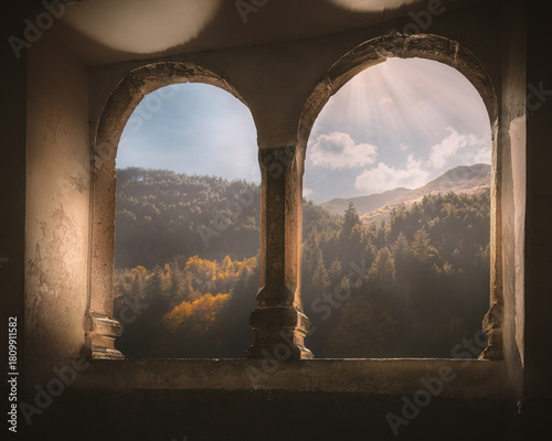 View of San Domenico Lake Landscape Through Stone Arches or Bifora