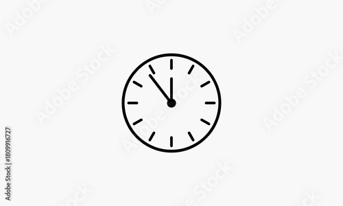 Black outline of a round clock face with twelve hour markers and two hands pointing to eleven oclock on a plain white background