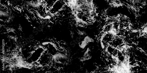 water drops on black background. Water splashing isolated over a black background