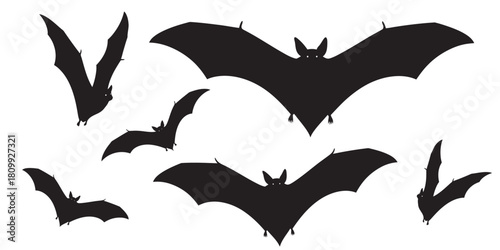 Silhouette bats flying in different poses for Halloween decoration or design