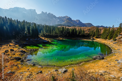 Scenic autumn landscape of Carezza lake or Lago di Carezza, Karersee in Dolomites Alps, South Tyrol, Italy, Europe	