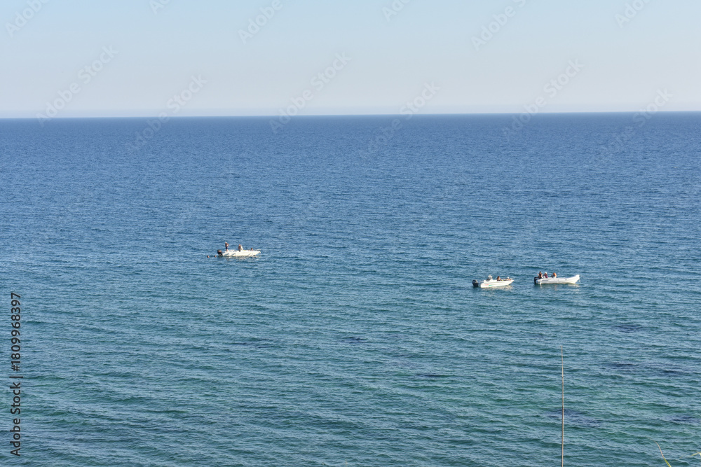 Obraz premium Sea view from Selinunte Archaeological Park, Trapani, Sicily, Italy. Travel to Italy. Sightseeing in Sicily. Summer and Holidays. Sicilian sea. Boats. 
