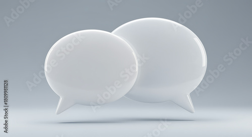 Conversation Bubbles: Conceptual rendering of two interconnected speech bubbles, symbolizing dialogue and communication. Evoking a sense of exchange and connection in a modern setting.