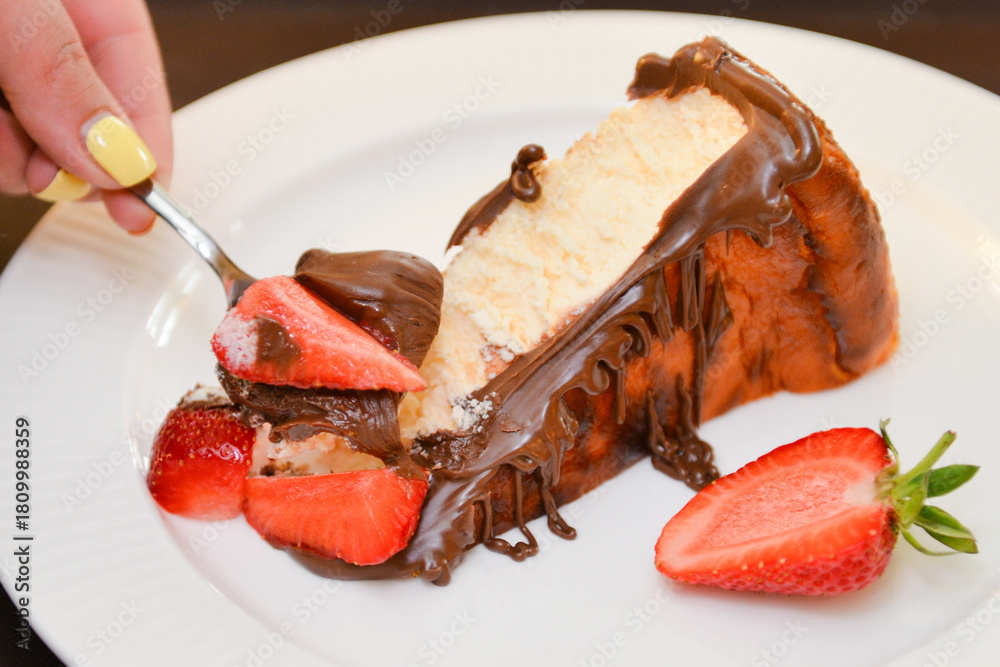Fototapeta premium San Sebastian cheesecake with chocolate sauce. Delicious homemade dessert.