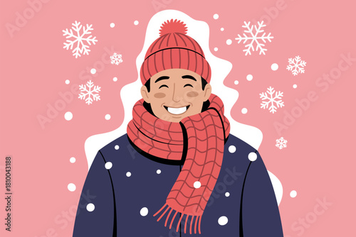 A smiling person dressed warmly in a hat and scarf during a snowfall.