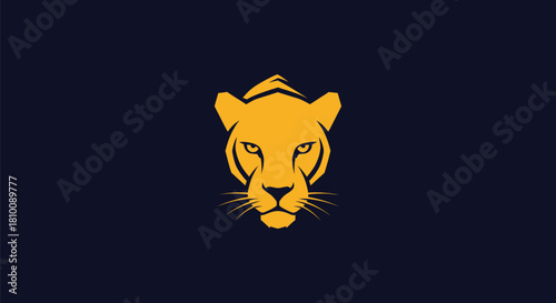 Gold stylized feline face on dark blue background. Simplified, geometric, and symmetrical