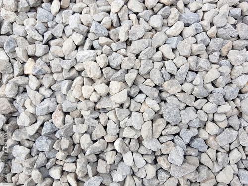 White grey small rocks texture background.