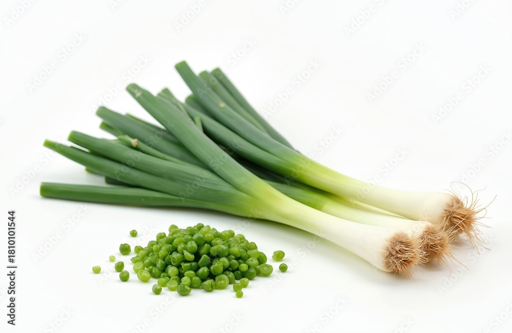 Obraz premium Isolated young green onion stalks on white. Fresh scallions, chopped scallion. Food blogger can use this vibrant, healthy food for vegetarian recipe book. Greens for spring detox.