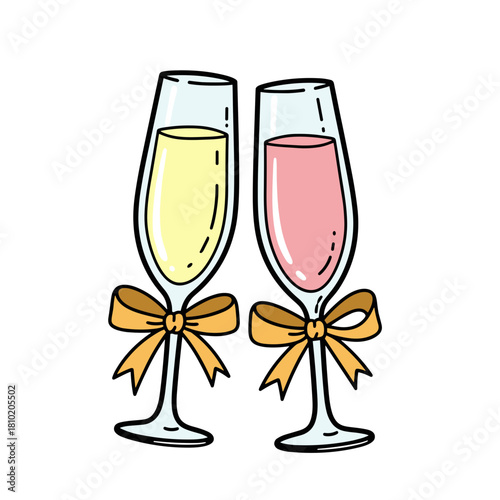 Two champagne glasses with yellow and pink drinks and bows  