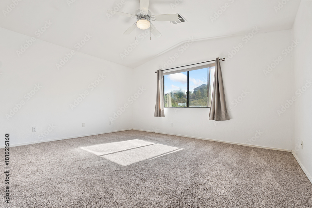 Obraz premium A Spacious and Modern Bedroom, Filled with Natural Light and Comfort