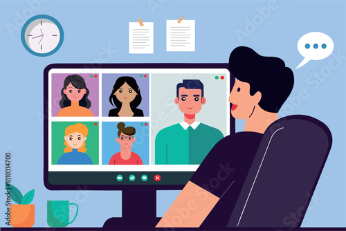 A man is sitting in a chair looking at a computer