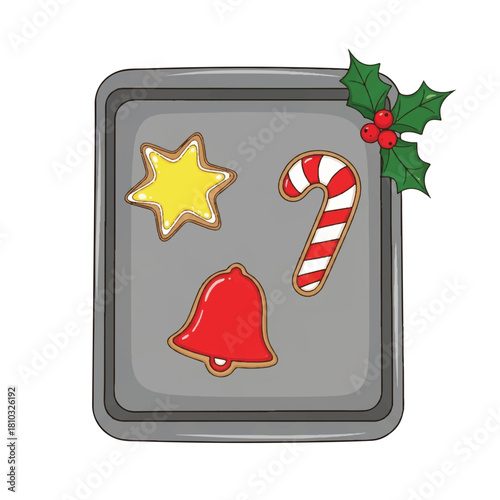Christmas Cookies on a Baking Sheet with Holly Decoration.