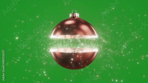 A shimmering Christmas ornament dramatically splits open, emitting a radiant glow and sparkling particles against a vibrant green backdrop, evoking festive magic.