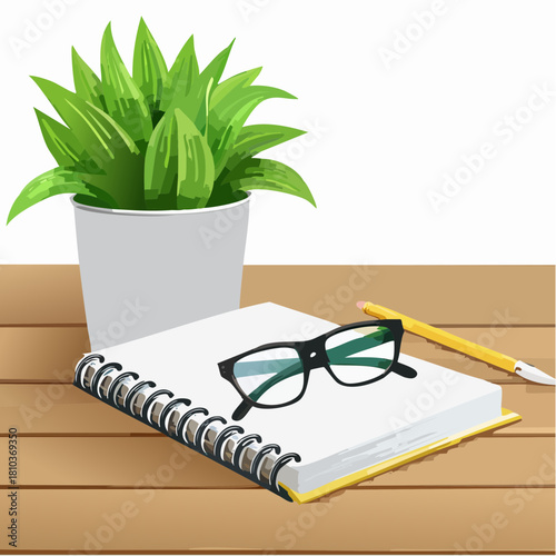 Desk setup with potted plant notebook glasses and pen.