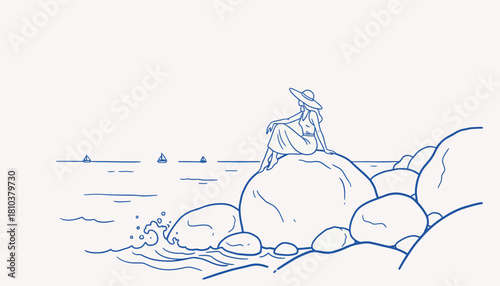 Woman in hat sitting on rocks overlooking the sea with sailboats