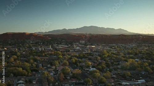 Aerial flyover of central St. George, Utah in the early morning on a clear day with blue sky