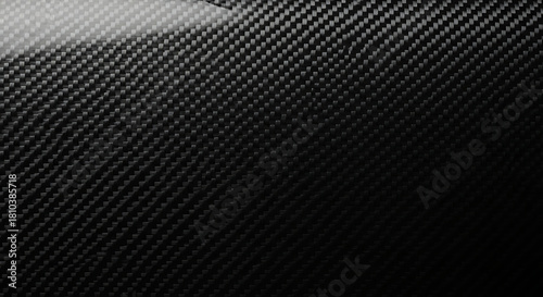 Close up of shiny black carbon fiber weave texture background