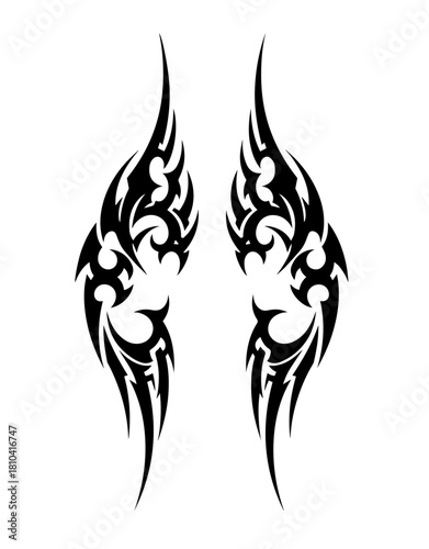 A symmetrical pair of vertical black tribal tattoo designs featuring sharp curves, aggressive spikes, and swirling organic shapes resembling stylized wings or flames, isolated on a white background