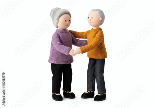 Stuffed dolls of an elderly couple holding hands and hugging, symbolizing love, marriage, and lifelong partnership