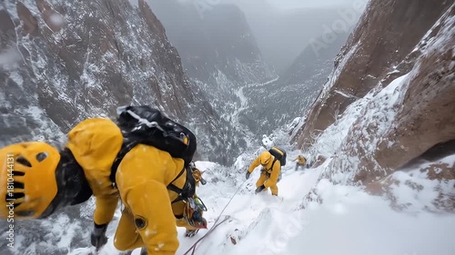 Adventurous mountain climbers ascending a snowy, rugged peak in winter gear, showcasing teamwork and breathtaking landscapes
