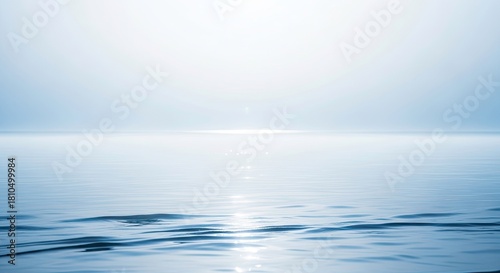 Fototapeta Naklejka Na Ścianę i Meble -  Calm sea with a soft light reflecting on the water, creating a peaceful and serene atmosphere