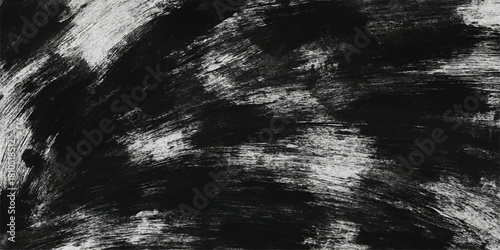 Abstract stormy blue sky with dark clouds over sea creates a black and white texture resembling a grunge background