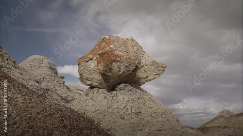 A timelapse of clouds passing by a petrified tree stump in the Bisti rock garden, near the Bisti Badlands, NM