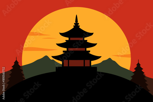 Silhouette of a japanese pagoda against a vibrant sunset and mountains