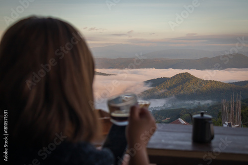 Woman Drinking Coffee with Mountain View