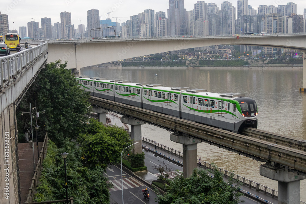 Fototapeta premium Chongqing metro train travel on the high rise track in Chongqing city, China