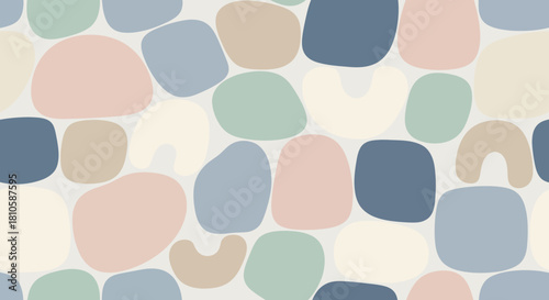 Abstract pastel-colored irregular shapes scattered across a minimal