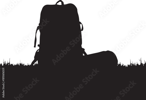 Black silhouette of a backpack on grass white