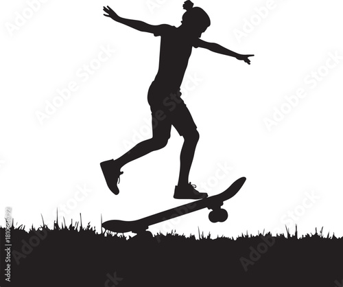 Black silhouette of person skateboarding on grass child