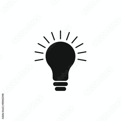 Solid black silhouette icon of a glowing light bulb with radiating lines. Symbolizes a bright idea, illumination, inspiration, and solution found. Excellent vector graphic for business concepts