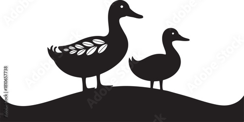 Black silhouette of two ducks one larger than the other with decorative leaves on its side standing on a wavy ground