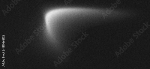Abstract background with a soft glowing white light leak on a dark, grainy texture. noise background
