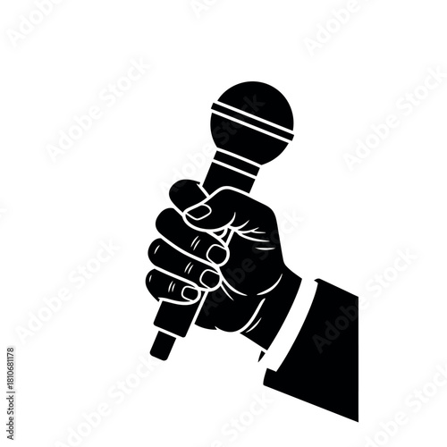 Hand holding microphone for interview or performance.