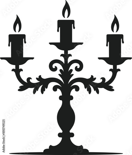 Black silhouette of a three-armed candelabra with lit candles
