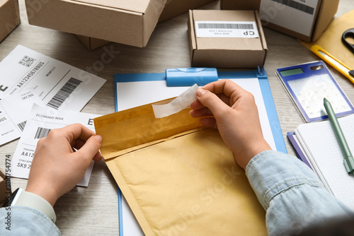 Female postal worker with p...